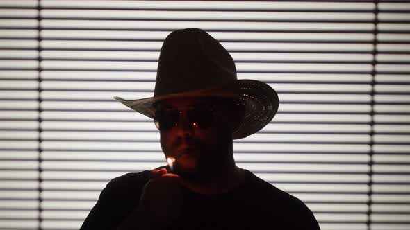 Shadow of Man Wearing Hat and Sunglasses Closeup