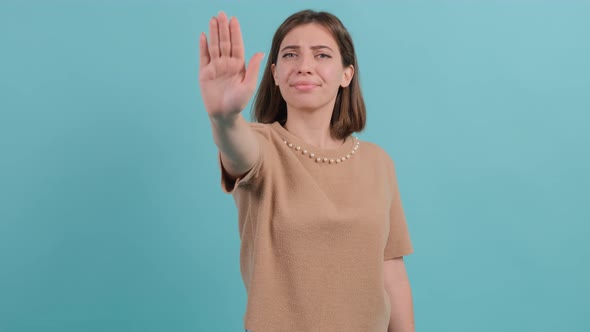 Close Up of Young Woman Making Stop Gesture with Her Hand