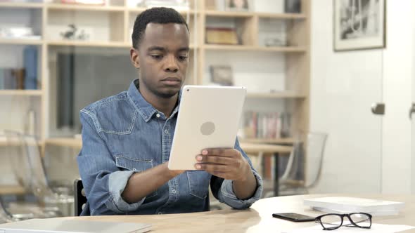 Afro-American Man Using Tablet
