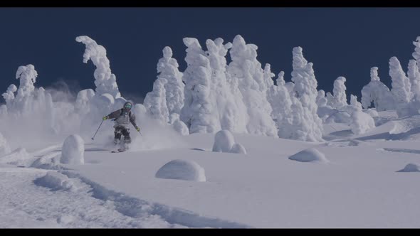 Downhill Skier Turning Through Heavy Snow