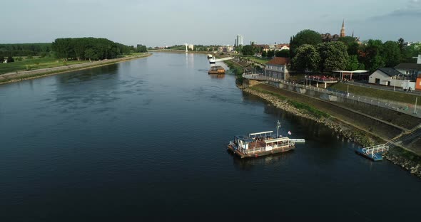 Aerial view of a passenger ferry boat crossing Drava river, Osijek, Croatia.