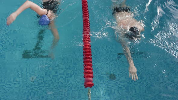 Happy Swimmers High-Fiving after Competing