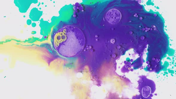 Vibrant multicolored drops of inks in oil