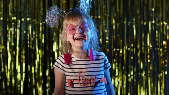 Portrait of Fashion Gorgeous Girl in Futuristic Night Club with Blue Neon Lights Laughing at Loud