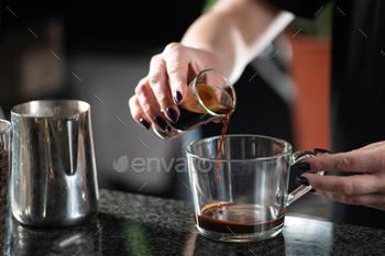 Female Barista Pouring Espresso in a Chocolate Mocha Coffee