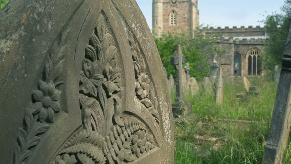 Passing Graves In Sunny Churchyard