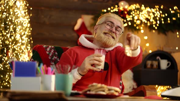 Milk and Gingerbread Cookie for Santa, Claus in His House Next To the Fireplace and Christmas Tree