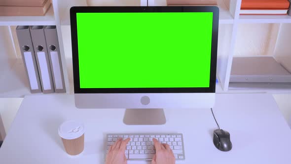 Businesswoman Entering Data in Office