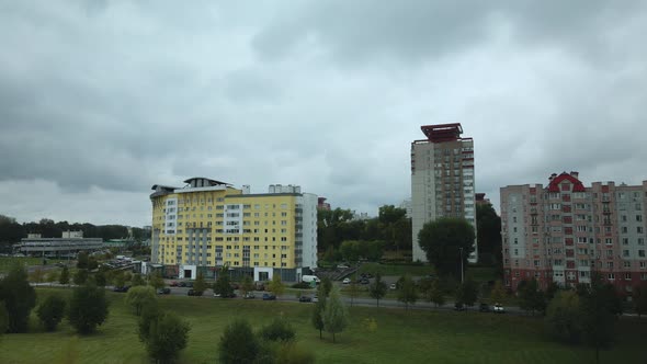 Flight over the city block in cloudy weather.