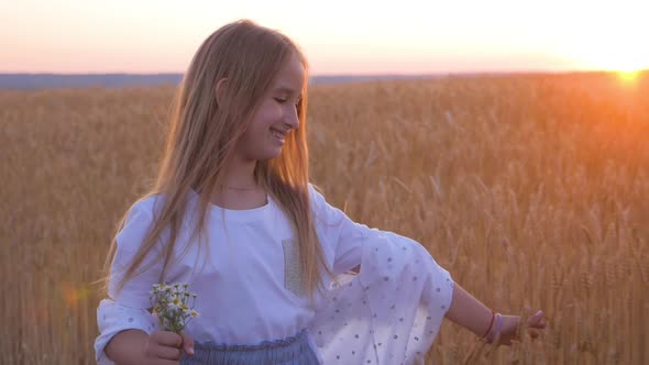 Pretty Girl Walk Across the Wheat Field. Happy Young Girl Running in the Field at Sunset. Freedom