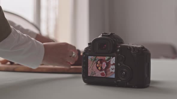 Food Photographer Creating Composition