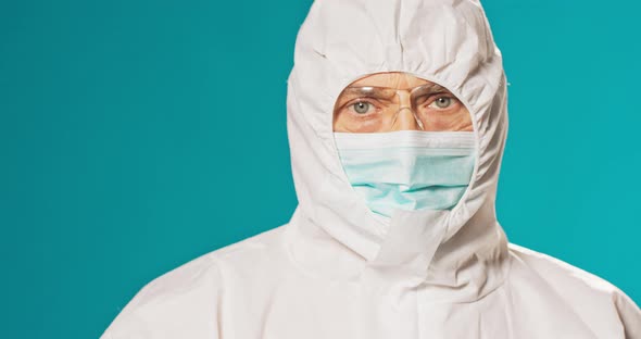 Paramedic Physician Secured in Protective Clothing Medical Uniform Isolated From Virus Coronavirus