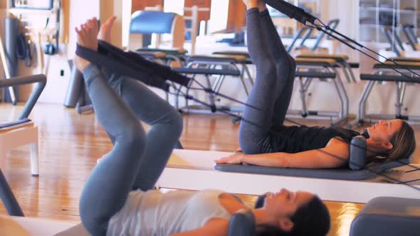 Women exercising on gym equipment