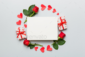 Frame made of rose, git box, heart and blank greeting card mockup