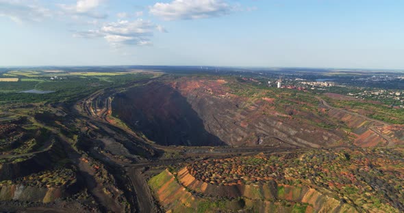 Open Pit Stone Quarry Aerial View with Terraces and Colorful Tailings Aerial View