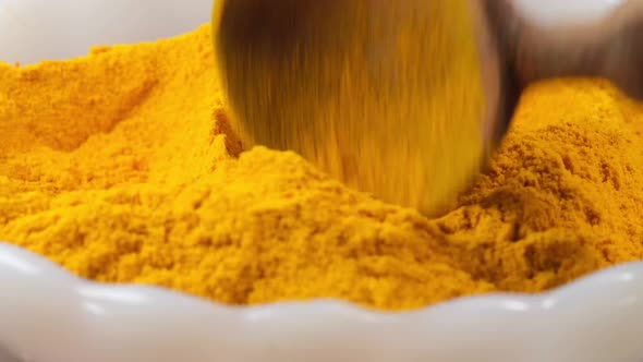 Turmeric Root Powder in Bowl on Table 