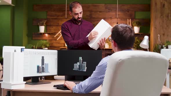 Team of Architects Having a Conversation in the Office