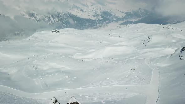 Aerial drone view of snow covered mountains in the winter.