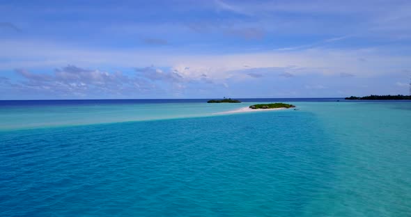 Tropical birds eye copy space shot of a white sandy paradise beach and turquoise sea background in v