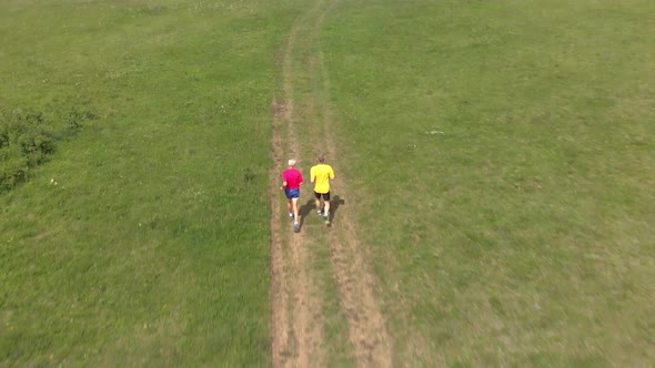 Senior runner running in meadow 