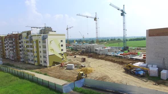 construction of boxes of modern high-rises at the initial stage in the city. Aerial view