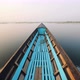 Old Blue Wooden Boat Floats on the Calm Water Surface Early Morning. Inle Lake, Myanmar. Slowmotion - VideoHive Item for Sale