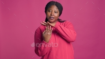 Woman showing timeout sign with hands