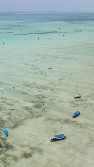 Tanzania  Vertical Video Kitesurfing Near the Shore of Zanzibar Slow Motion