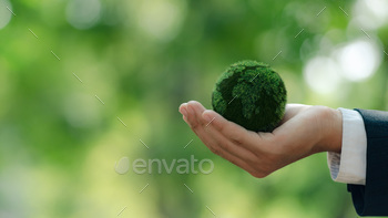 Environment and Earth Day.Green Earth in businessman hands for Protecting Planet.Green business.