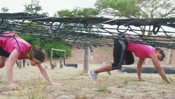 Female friends enjoying exercising at boot camp together