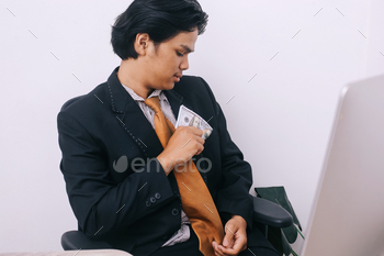 Businessman Inserting Money on Pocket