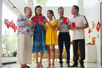 Family Members Exchanging Red envelopes