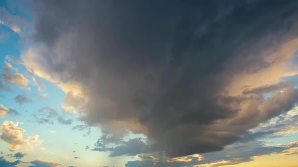 Dark Stormy Clouds on Yellow Sky at Sunset