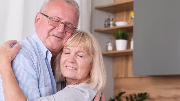 Happy Elderly Couple Hugging