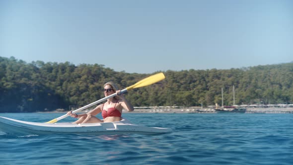 Kayaking Kayak Canoe Water Tourism.Paddling Canoe Adventure.Woman Spending Day Kayaking On Sea.