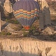Colourful Hot Air Balloon with Basket Flies Over Cliffs - VideoHive Item for Sale
