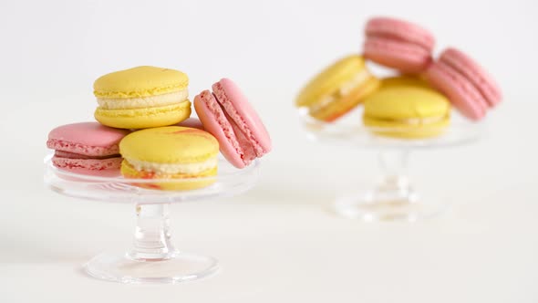 Yellow and Pink Macarons on Glass Stands