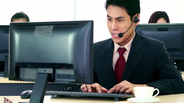 Business People Wearing Headset Working in Office