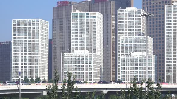 busy traffic and modern buildings in Beijing city , China.