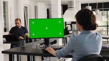 Analyst checks greenscreen desktop