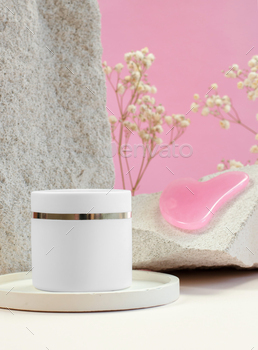 white jar of cream and a scraper for gua sha massage on a round stand. Cosmetics advertising mockup