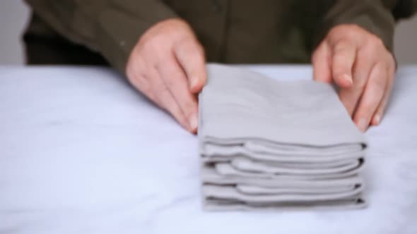 New linen dinner napkin on marble countertop.