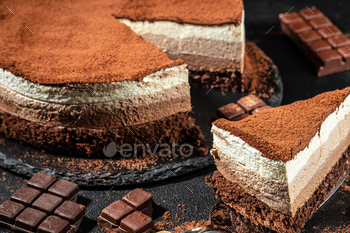 Freshly made delicious chocolate cake on a dark background. banner, menu, recipe place for text