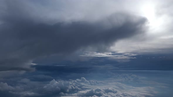 Flying Between Layers of Clouds in Beautiful Cloudscape in Sky on Plane.