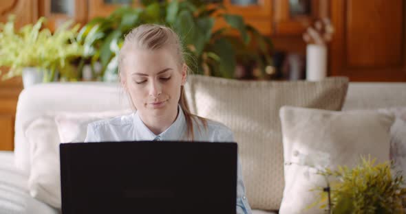 Beautiful Thoughtful Concerned Woman Working on Laptop