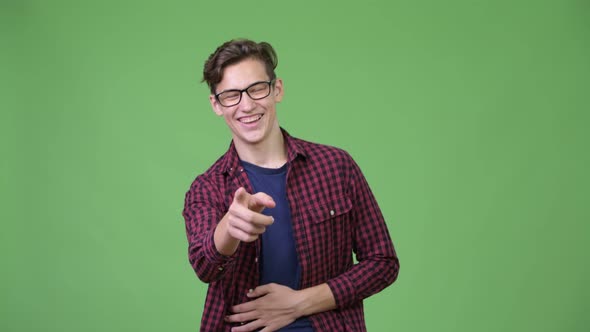 Young Handsome Teenage Nerd Boy Laughing