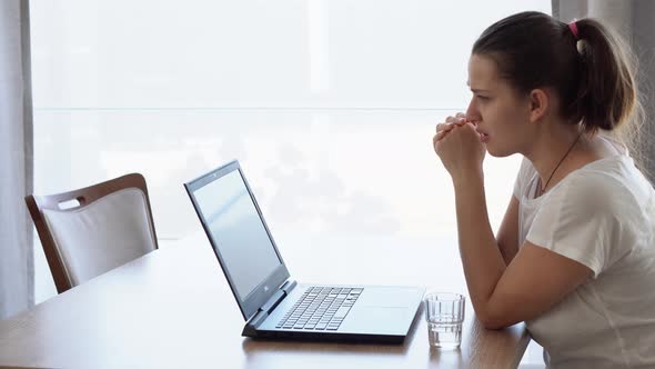 Authentic Caucasian Young Woman Chatting On Laptop At Home In Living Room