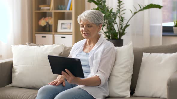 Senior Woman Having Video Chat on Tablet Pc 19