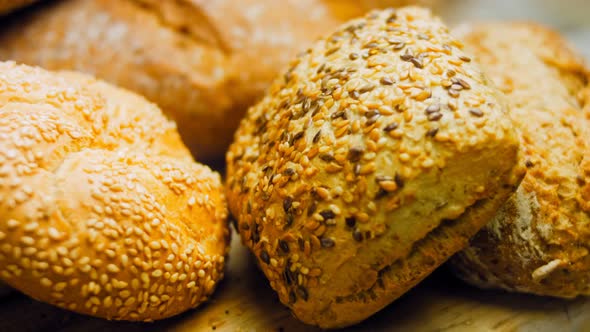 Different Kinds of Fresh Bread on Wooden Table