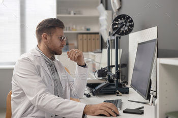 3D Printing Engineer Working on Computer